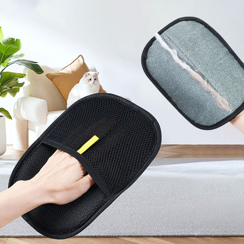 Reusable pet hair removal mitt lifting loose cat hair from fabric